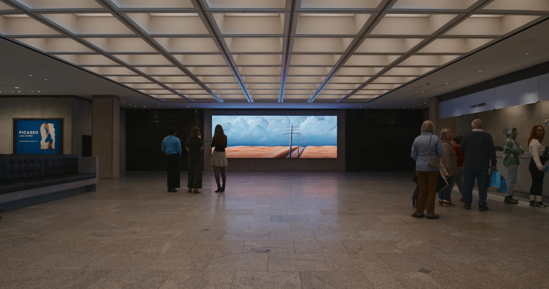 wide view of the Breuer lobby, showing the seating on the left, the LED wall center, and ticketing counter on the right.